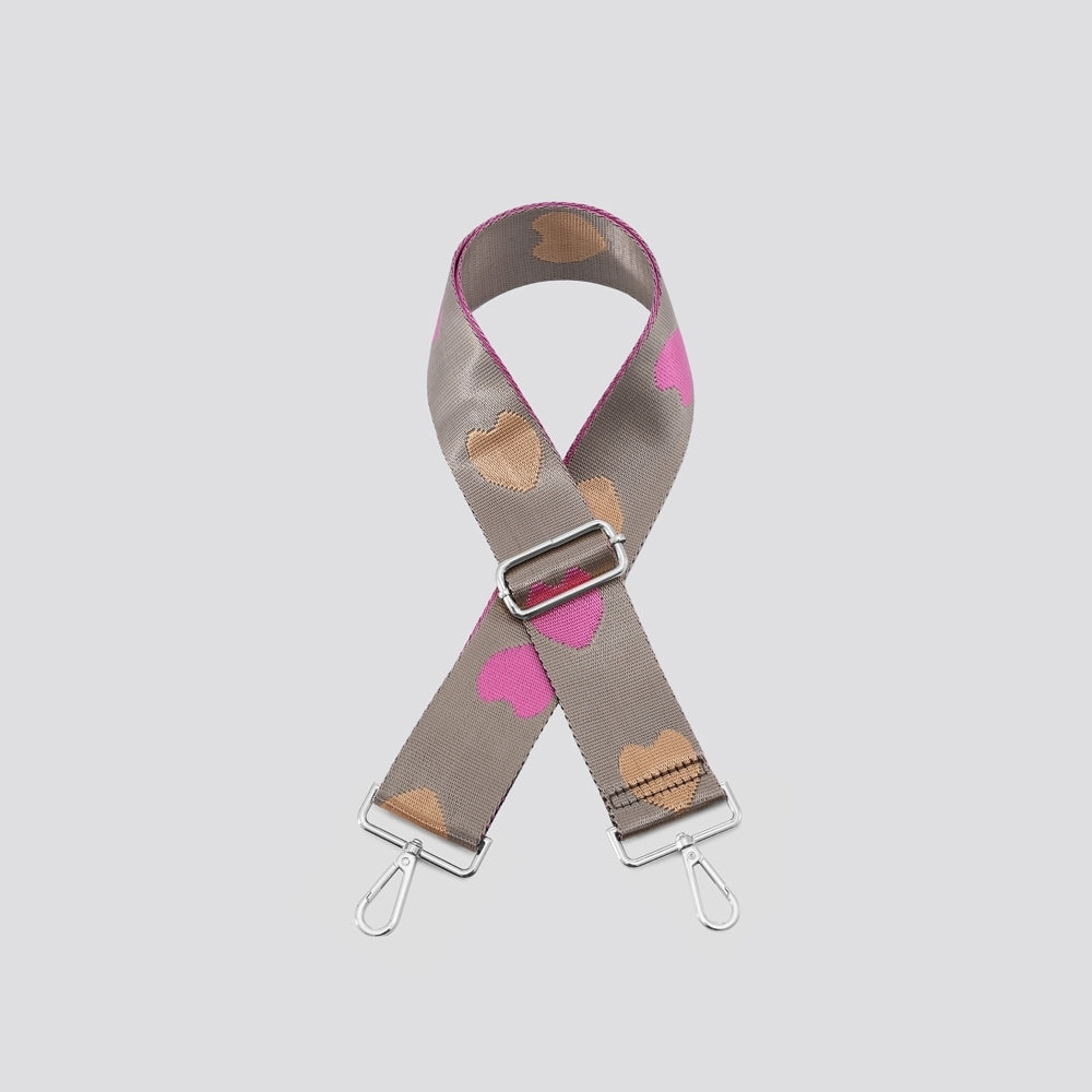 Wide bag strap with multi heart design and silver color hardware.