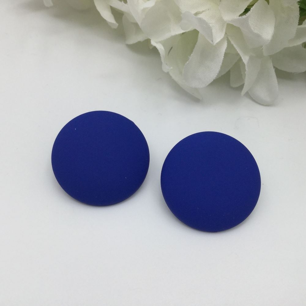 Blue round earrings with floral background.
