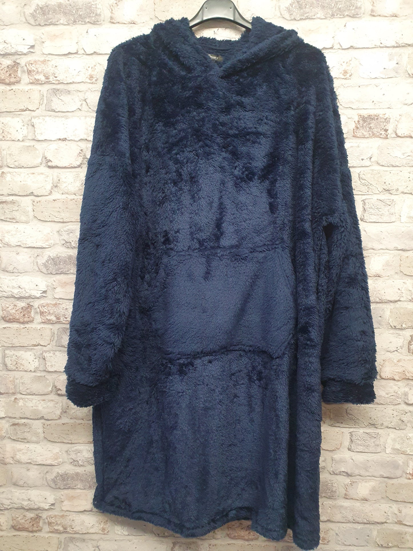 Unisex Blanket Hoodie in navy with hood and front pocket, soft stretchy polyester.