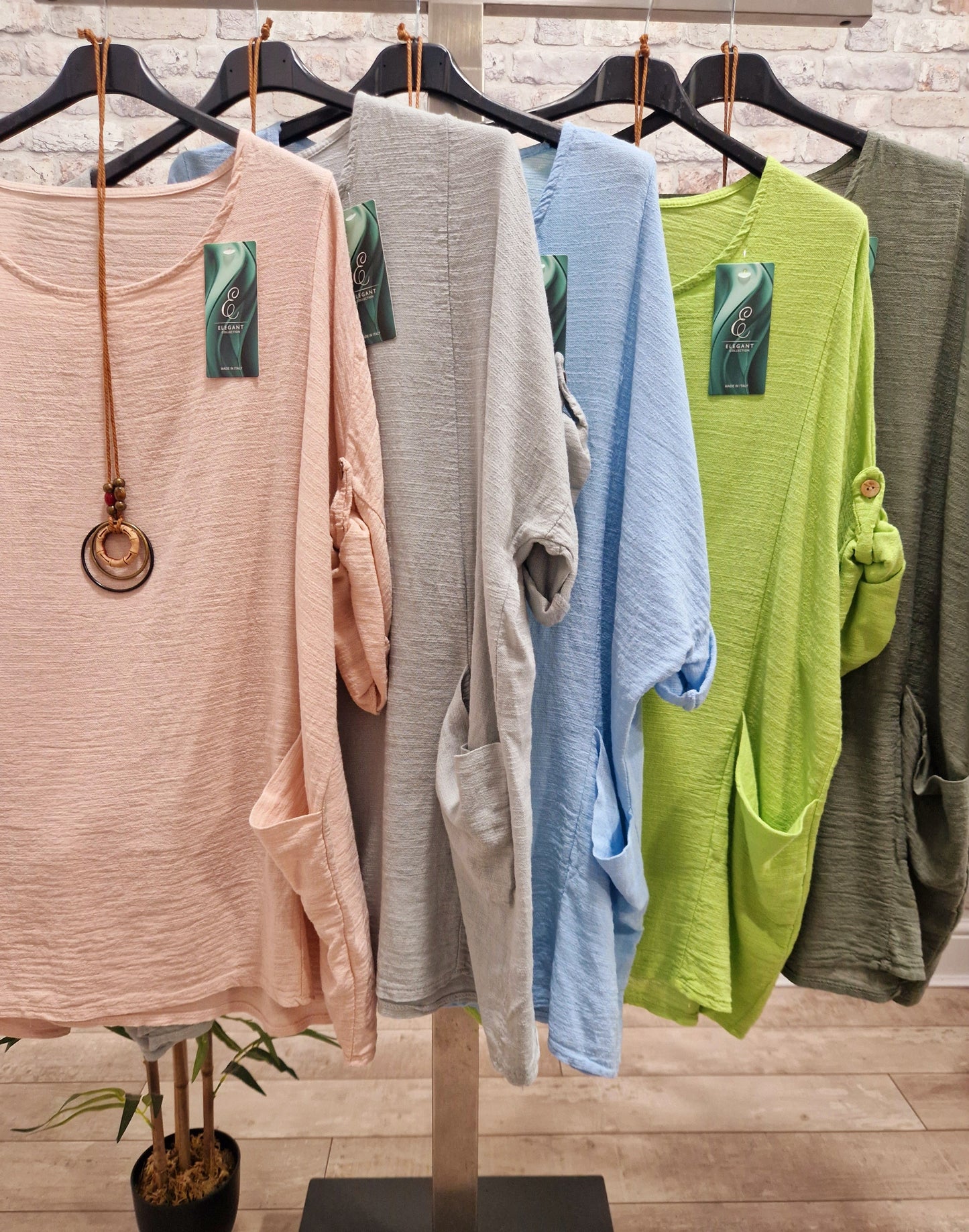 Plain Necklace Pocket Top in multiple colors with included necklace, made from 100% cotton, featuring front pockets and drop sleeves.