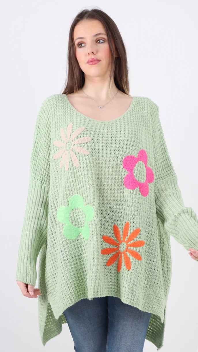 Side Slit Floral Jumper in pastel green with colorful flower patterns, 100% acrylic.