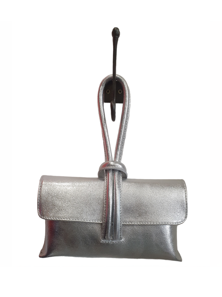 Metallic loop handle leather bag with detachable strap and internal zip pocket.