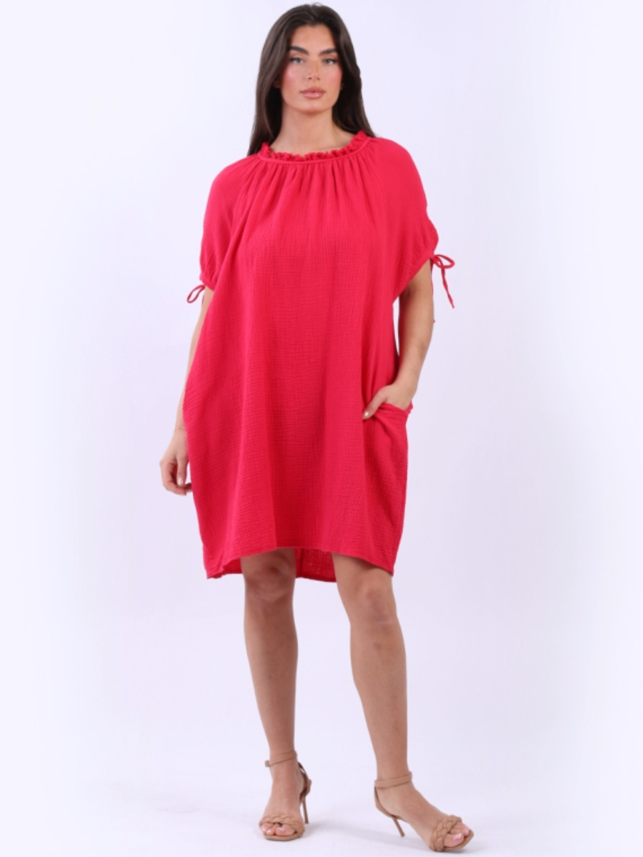 Cheesecloth drawstring dress with ruched neck, knotted balloon sleeves, and side pockets, made from 100% cotton.