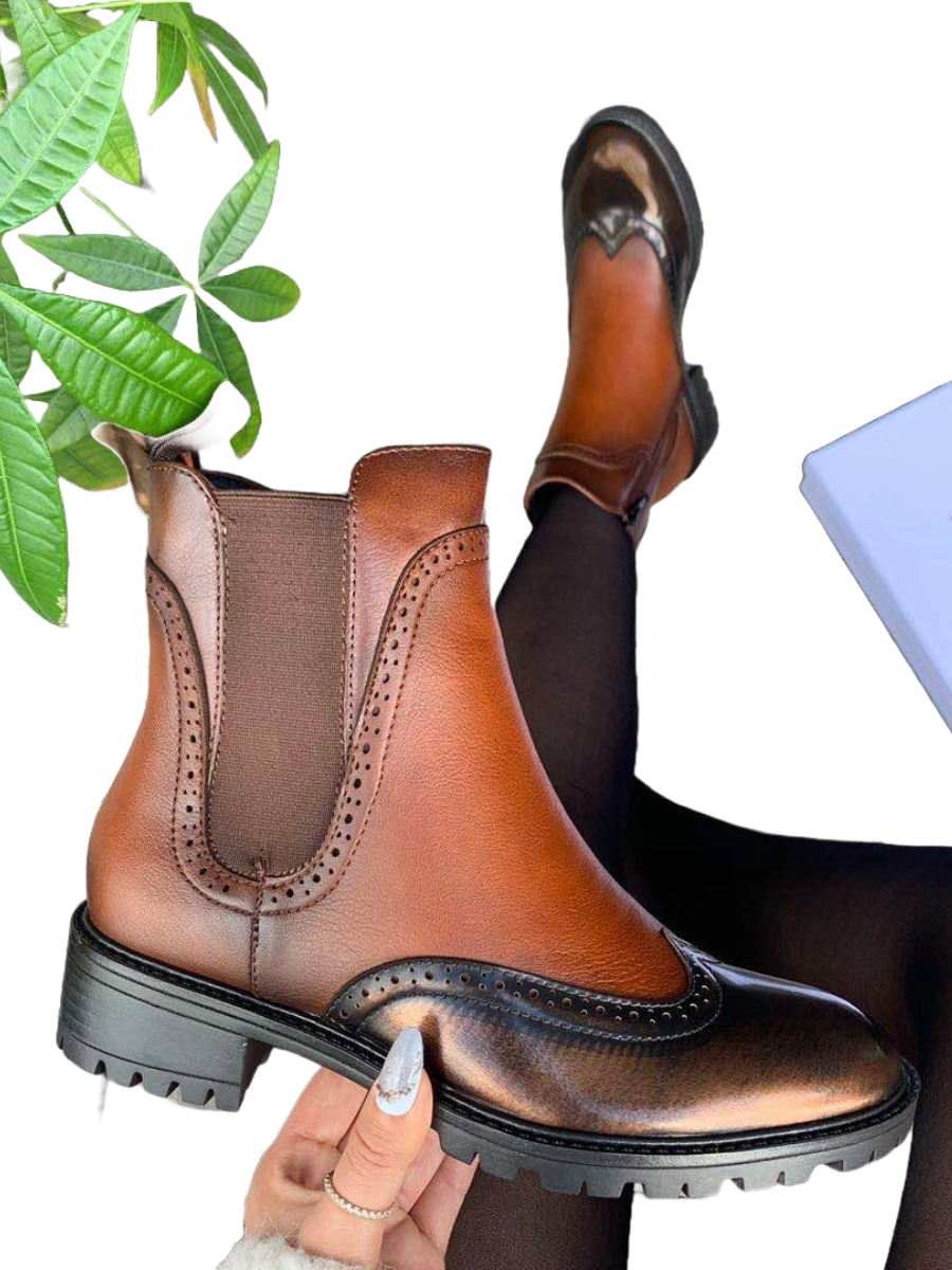 Patent Brogue Fleece Lined Boot with inner zip and stylish design.