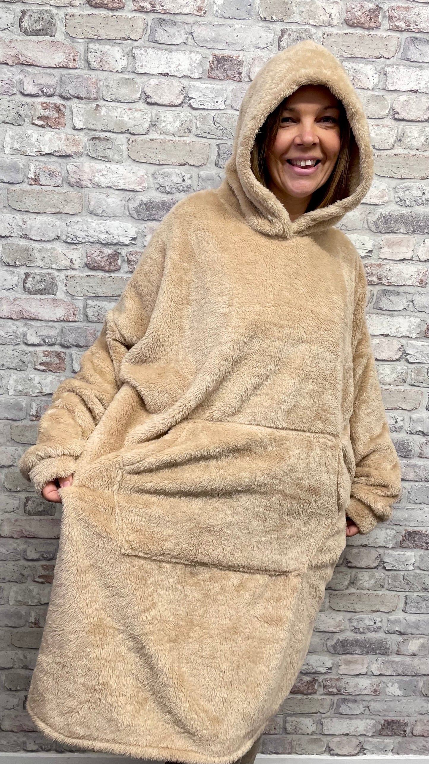 Unisex Blanket Hoodie with hood and front pocket, fits sizes Ladies 10-24, Men S-XXL, 100% polyester.