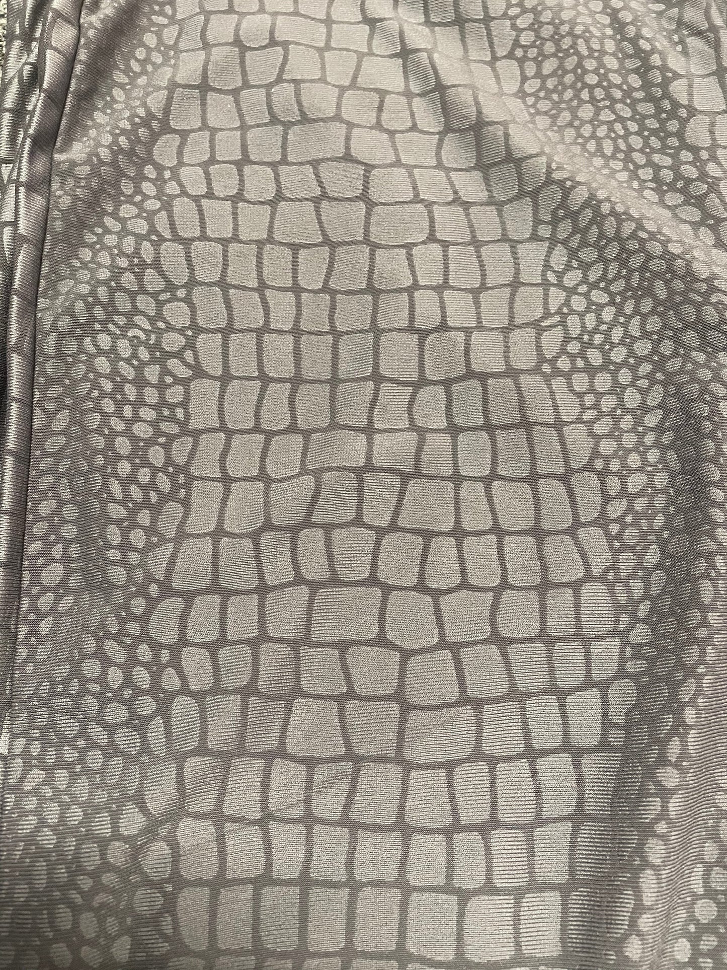 Croc leather look legging fabric texture.