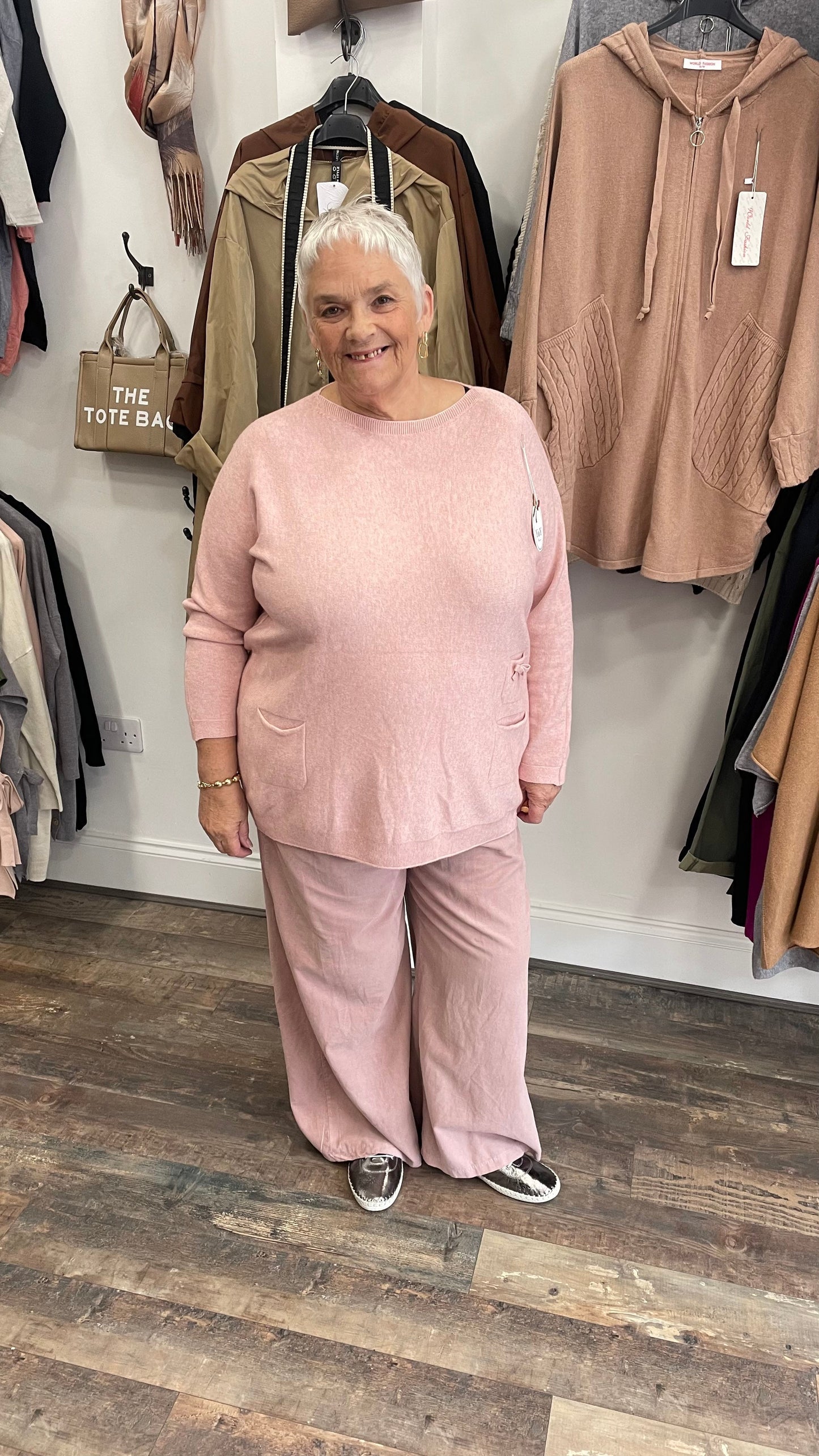Cord wide leg trouser in soft pink, featuring a relaxed fit and comfortable needle cord material, ideal for casual and semi-formal occasions.