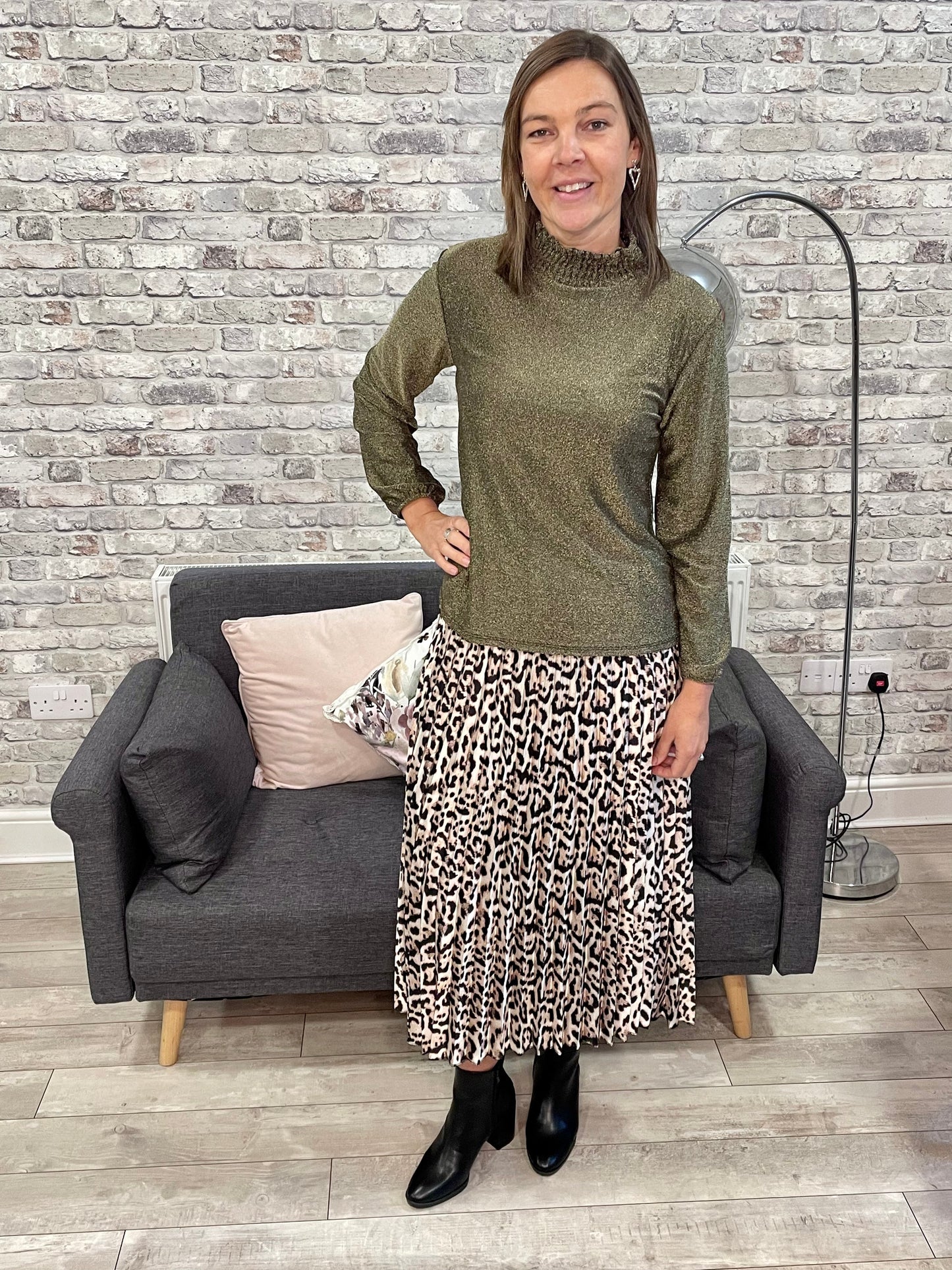 Metallic Frill Neck Top in green worn with leopard print skirt.