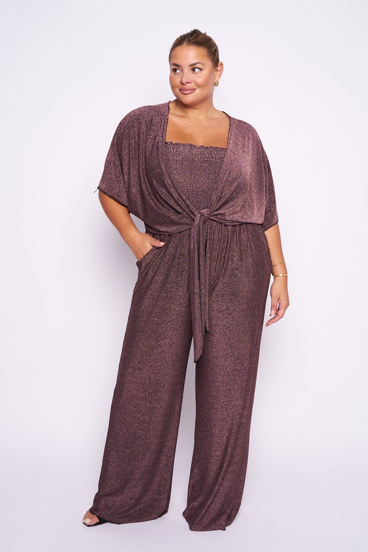 Lurex 2 piece shrug jumpsuit with wide leg and short sleeves.