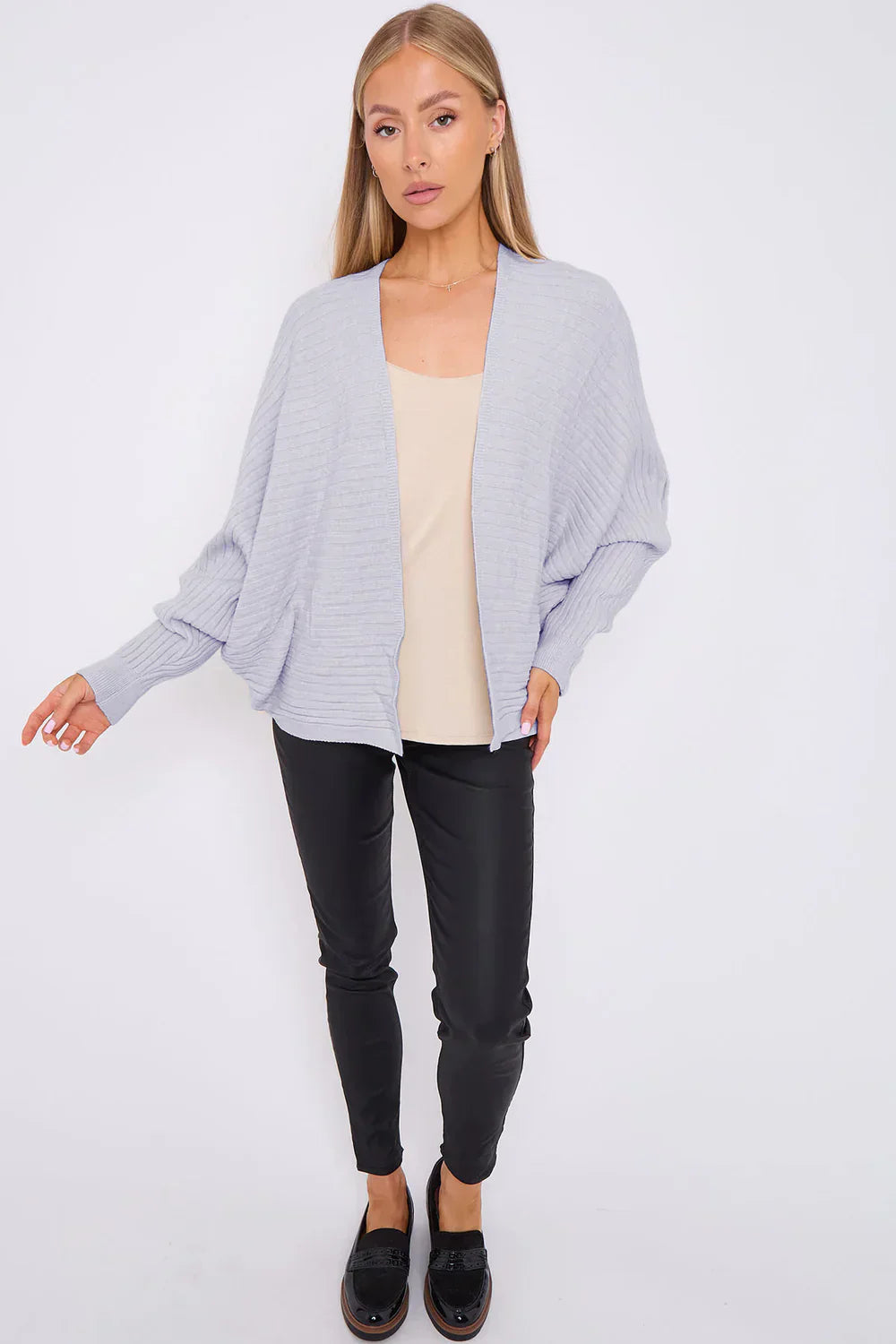 Ribbed batwing cardigan with open front and loose fit.