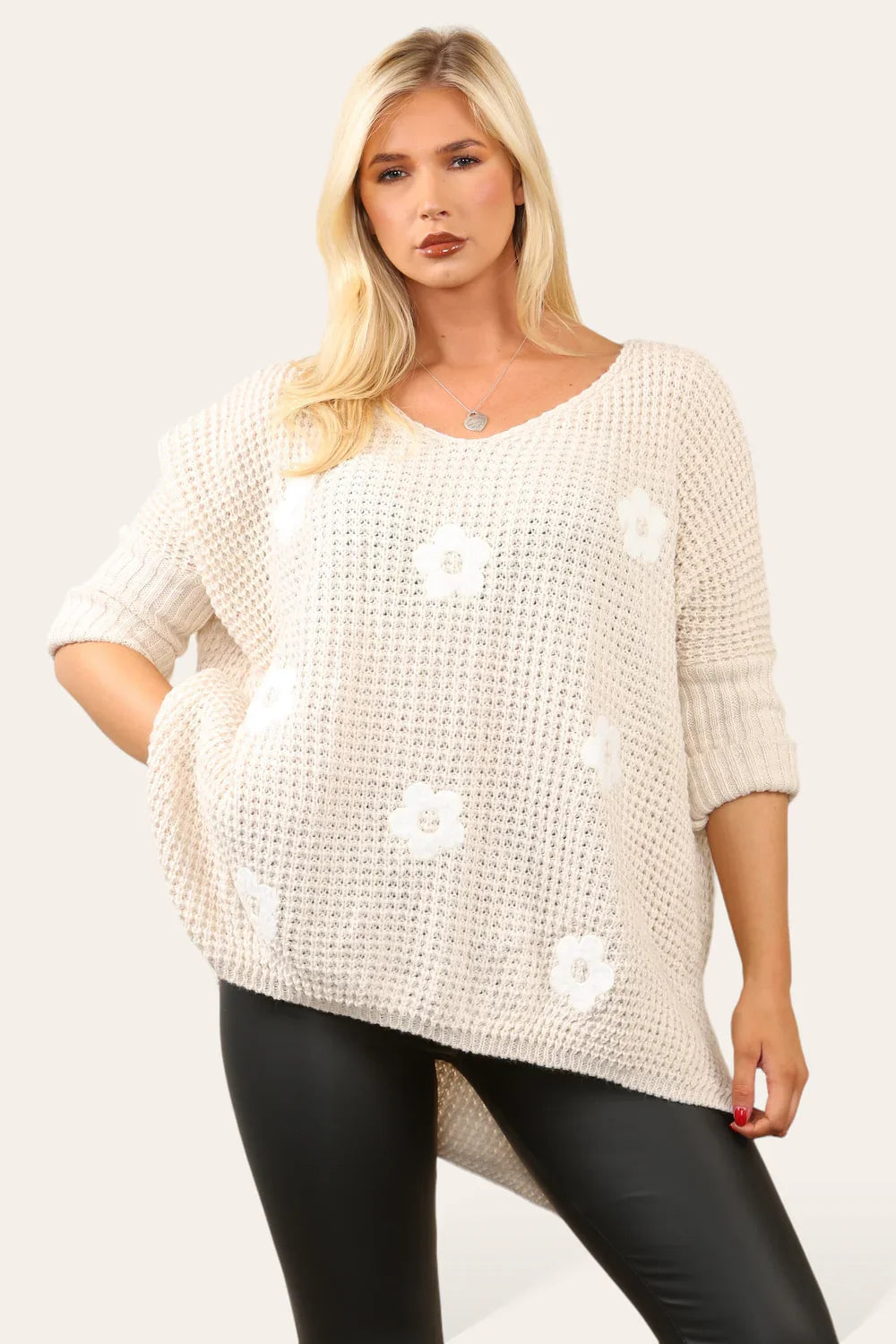 High Low Flower Knit Jumper with floral design and trendy high-low hem.