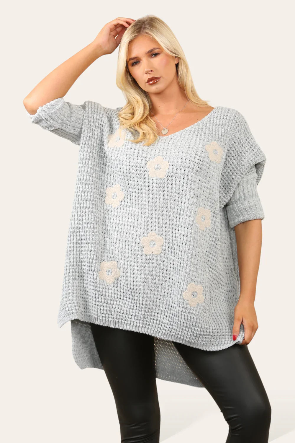 High Low Flower Knit Jumper with floral design and trendy hem.
