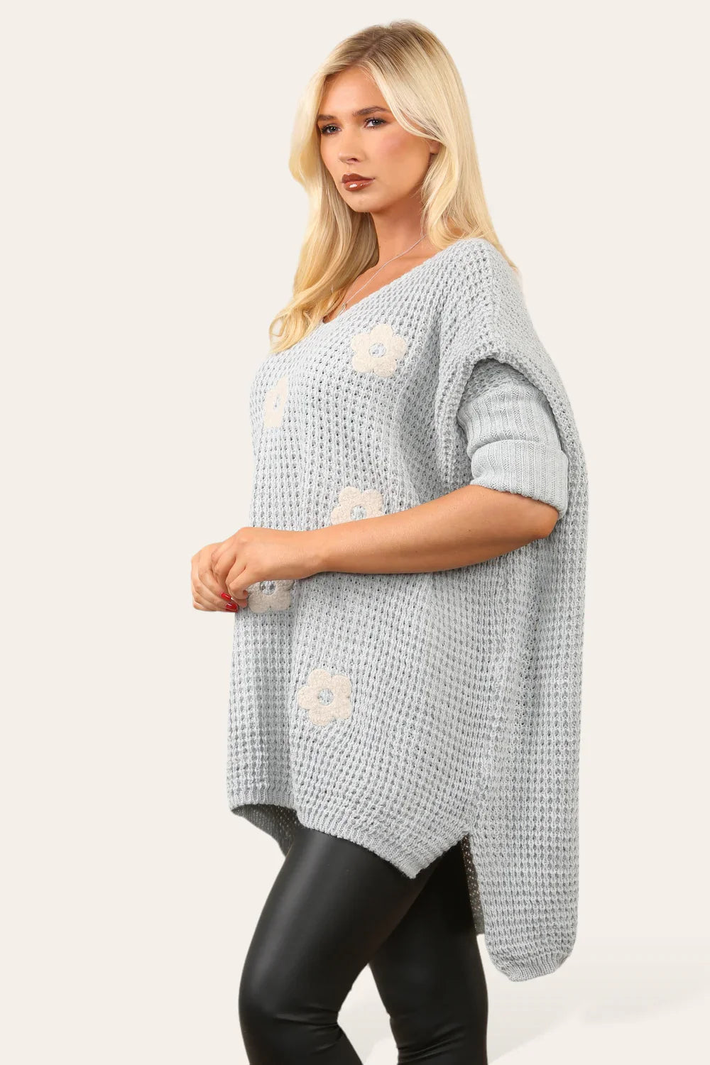 High Low Flower Knit Jumper with floral design and trendy high-low hem.
