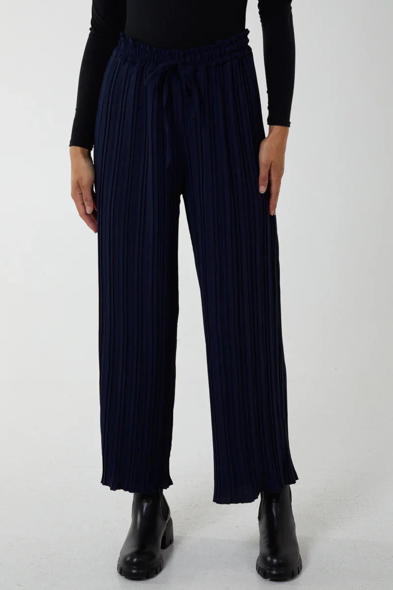 Wide leg plisse drawstring trousers with pleated design for casual and semi-formal occasions.