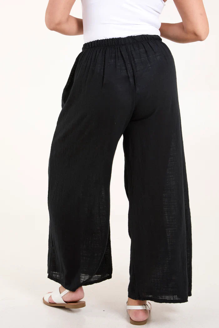 Cotton wide leg trousers, black, made in Italy, featuring side pockets.