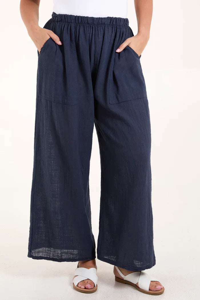 Cotton wide-leg trousers with side pockets, navy color, casual fit.