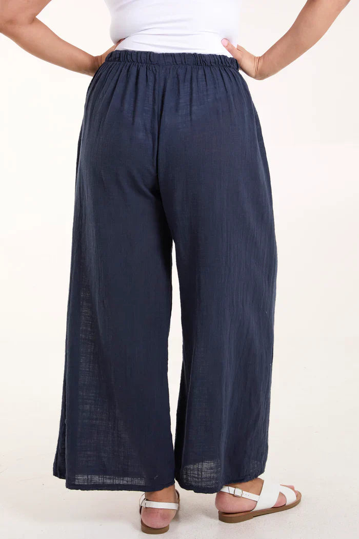 Cotton wide leg trousers with elastic waistband, navy color, casual style.