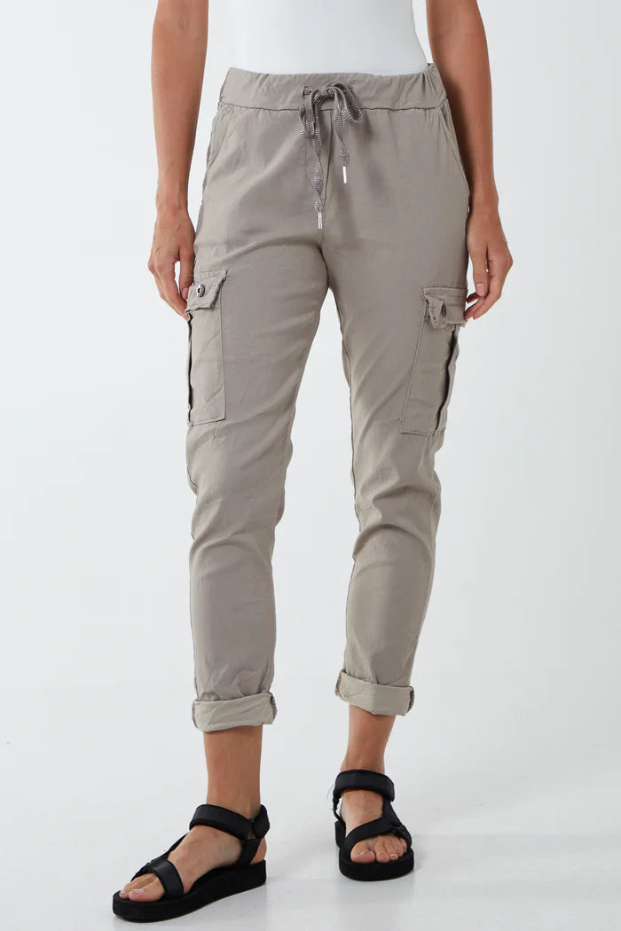 Magic Cargo Trousers made from viscose, polyester, and elastane blend, featuring pockets and an adjustable drawstring waist.