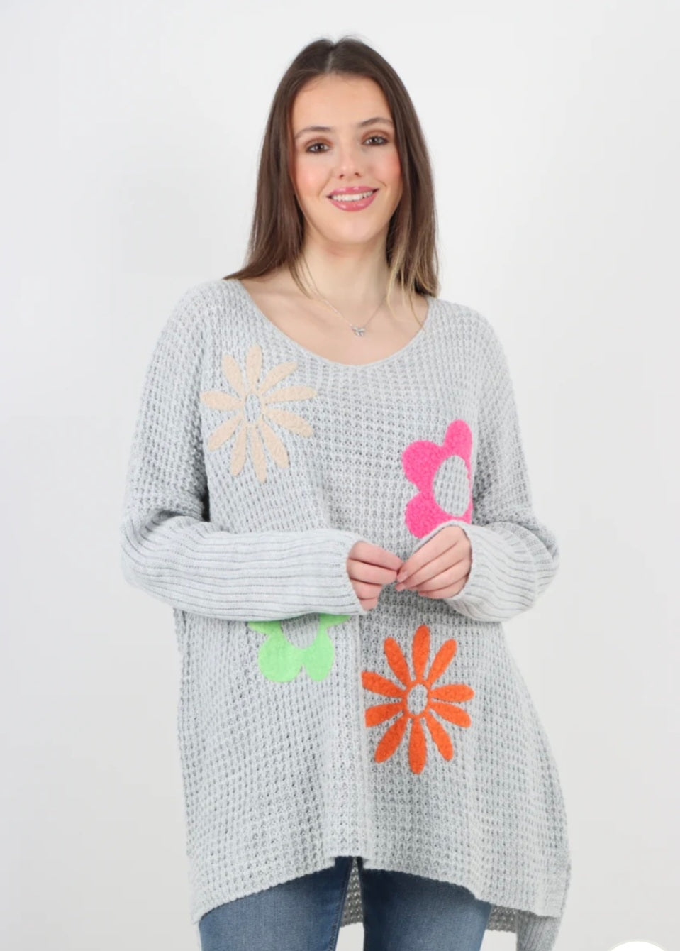 Side slit floral jumper with colorful flower design, 100% acrylic fabric.