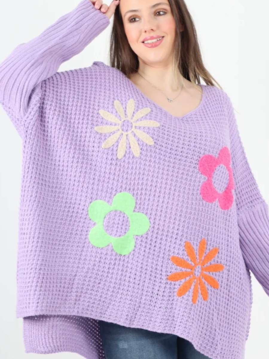 Side Slit Floral Jumper in purple with colorful flower patterns, long sleeves, and a relaxed fit.