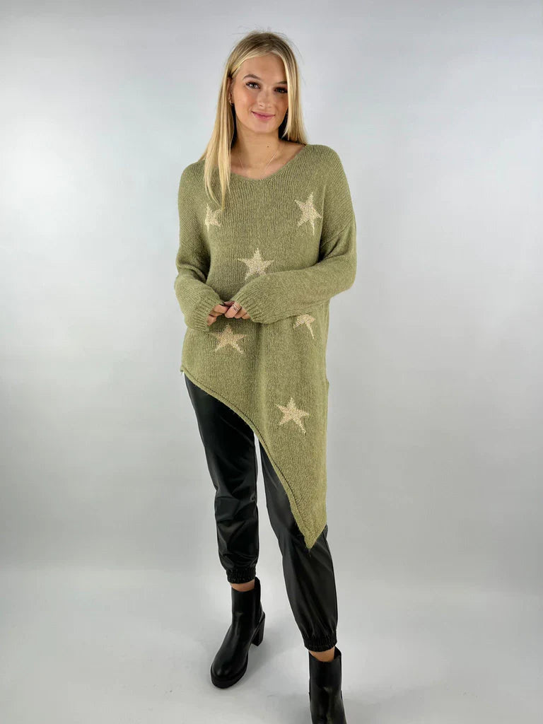 Asymmetric star jumper with bold star patterns and unique hem, perfect for casual outings.