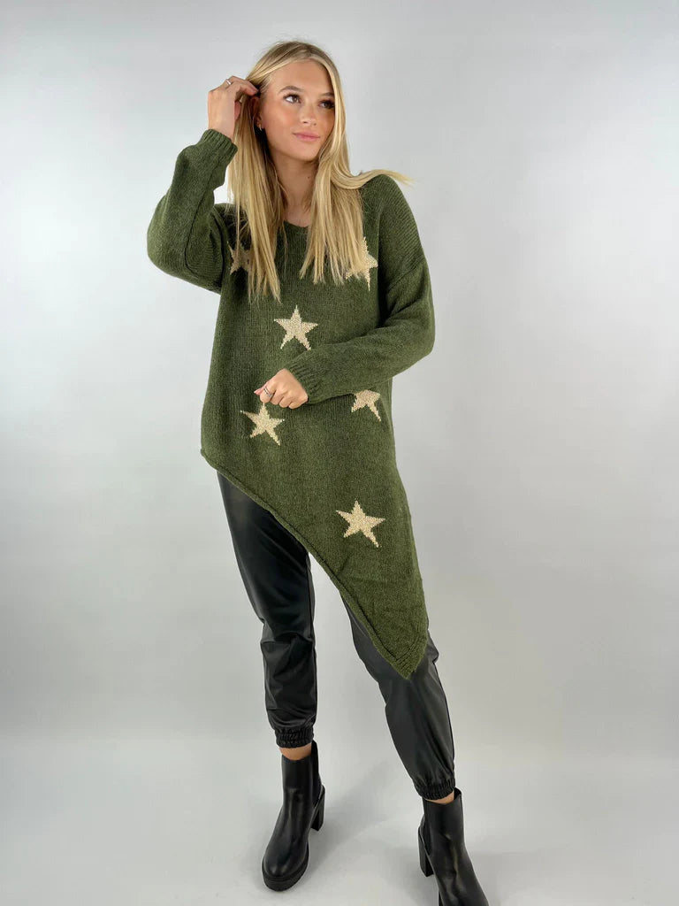 Asymmetric star jumper with bold star patterns and unique hem design.
