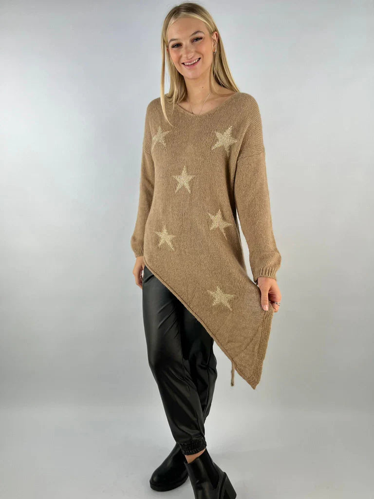 Asymmetric star jumper with bold star patterns and unique hem.