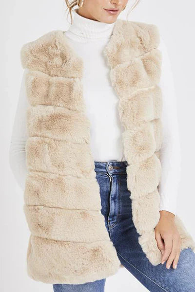 Ladies faux fur gilet with silk and leather-look lining, featuring pockets and slightly longer fit.