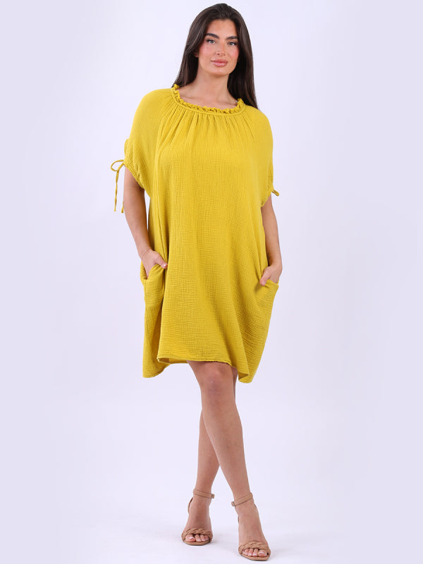 Cheesecloth Drawstring Dress with ruched neck and balloon sleeves.