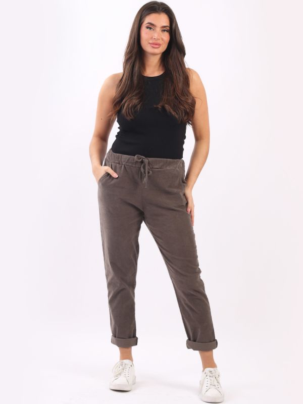 Cotton corduroy trousers with elastic waist and drawstring belt.