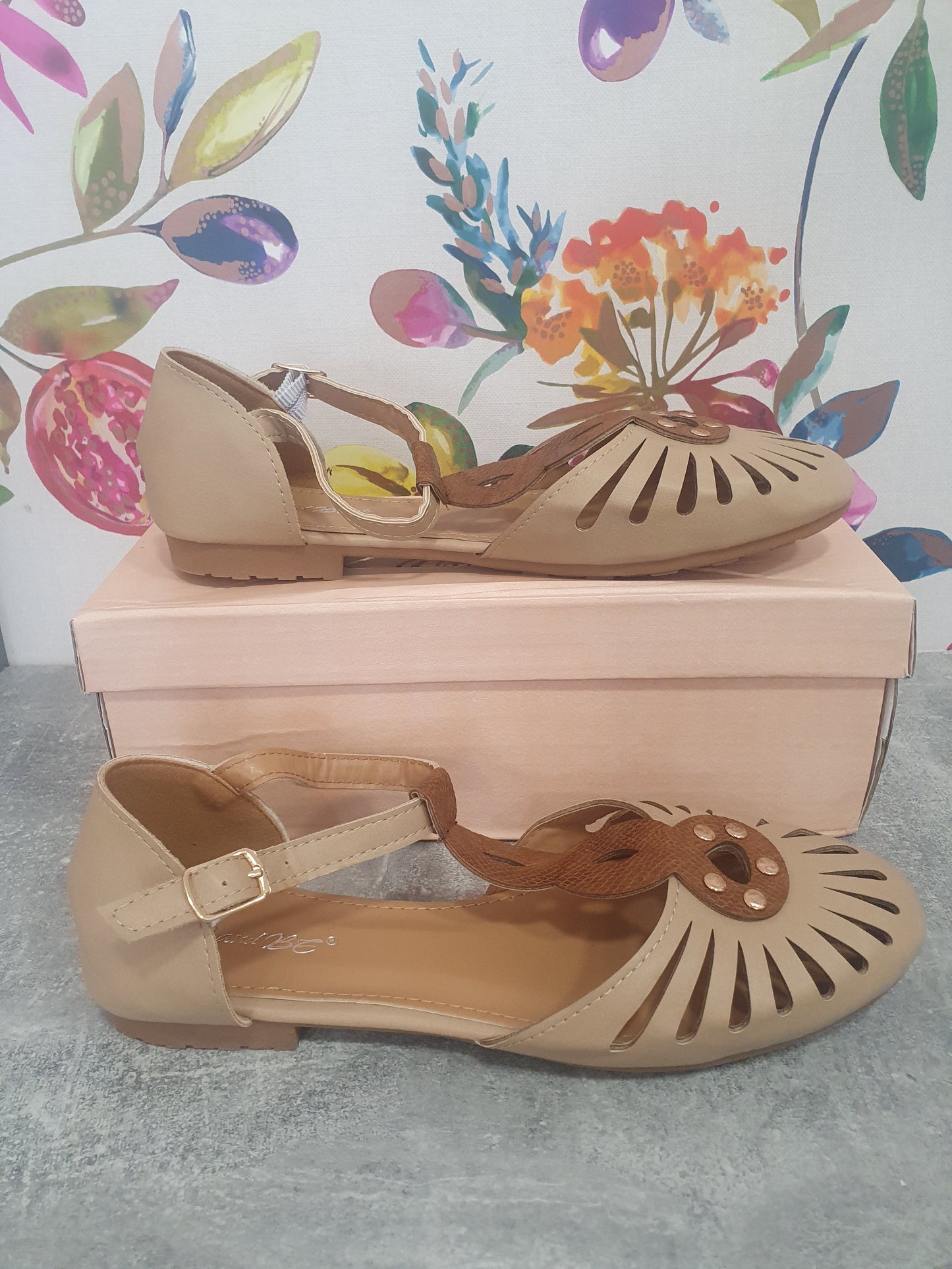 Filigree Ankle Strap Shoes in beige with cut-out design displayed on a box.