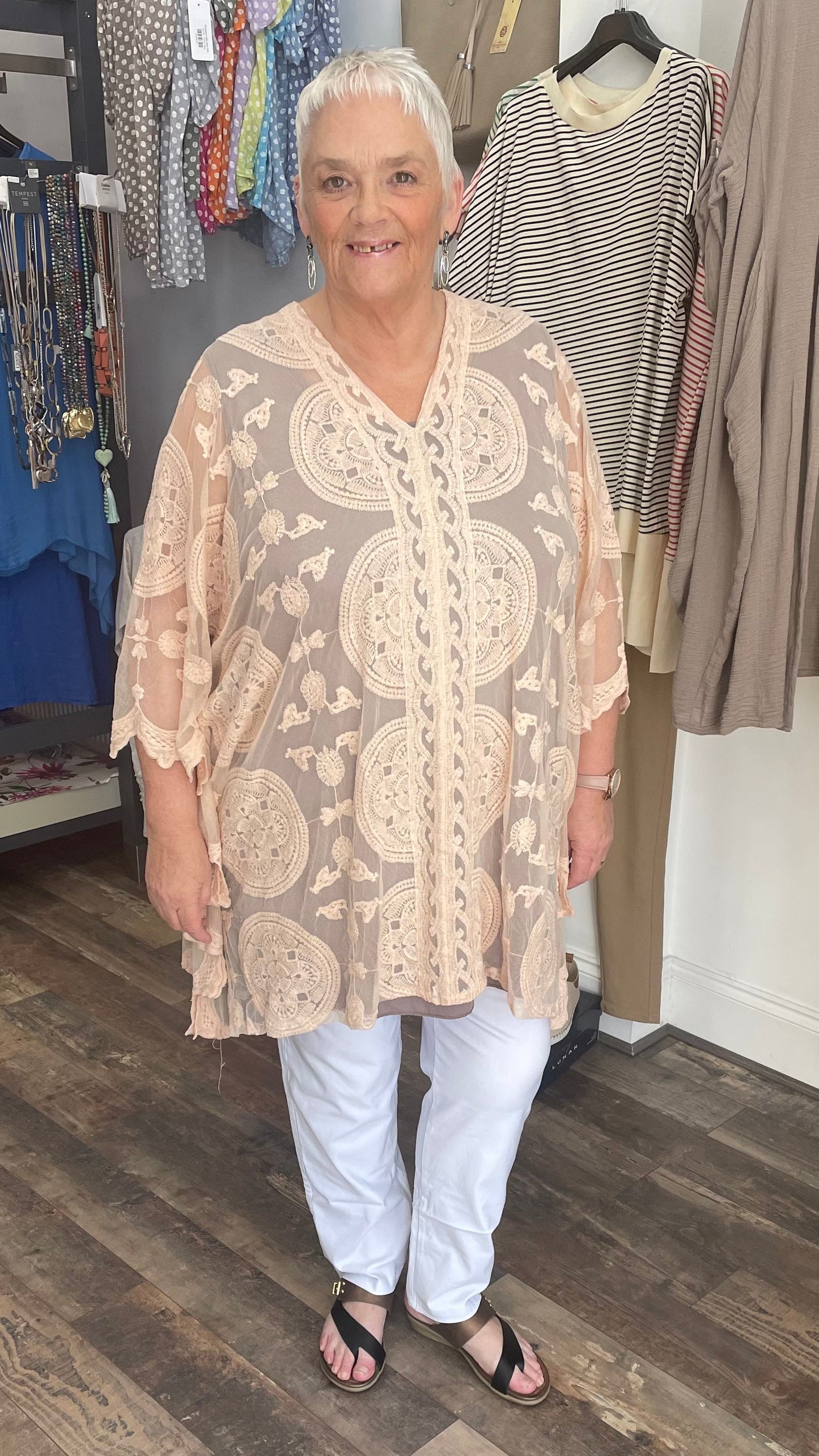Lace Poncho made of 65% cotton and 35% nylon.