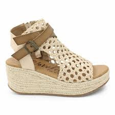Blowfish Lorrah Gold platform sandal with braided wedge, cutout upper, buckle, and side zipper.