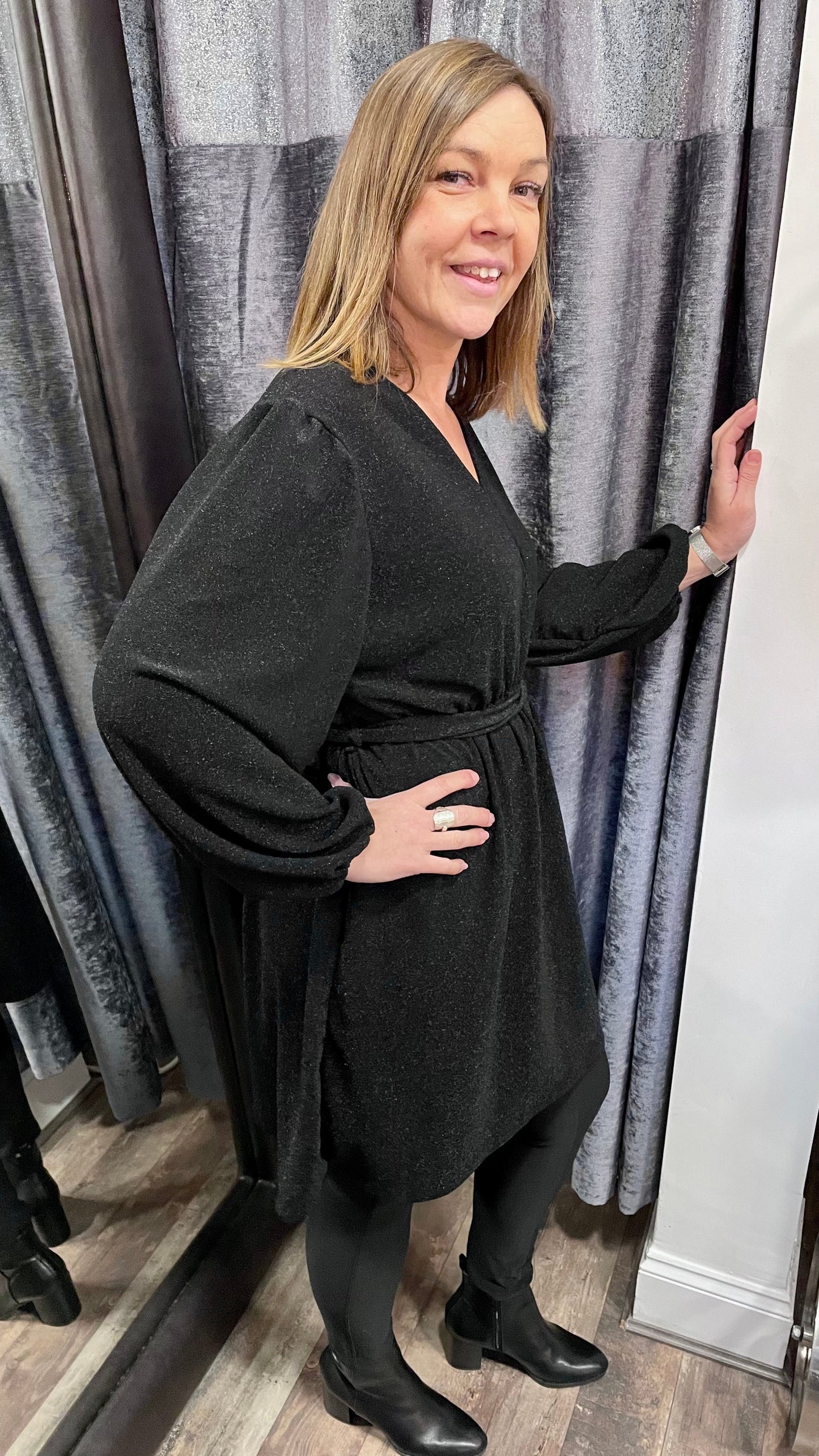 Women's black metallic thread V neck dress made from 95% viscose and 5% elastane.