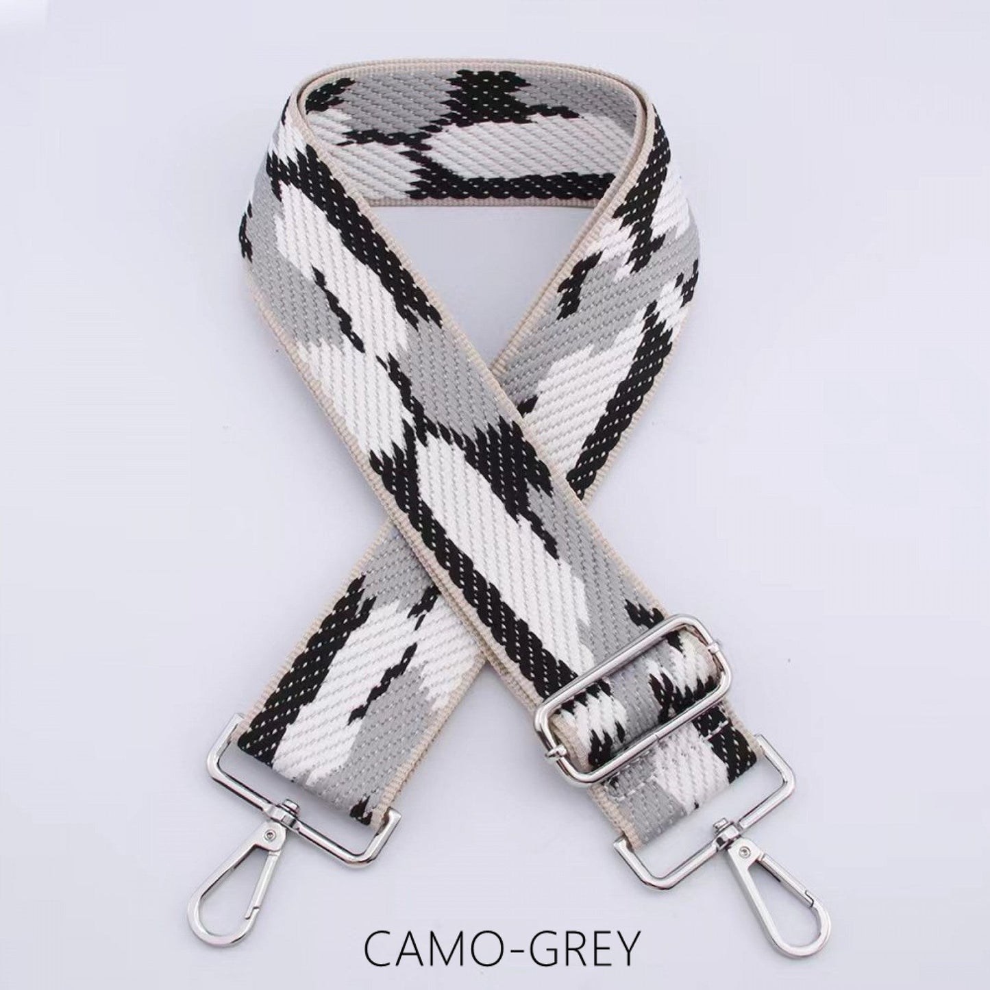Camouflage wide bag strap with silver hardware.