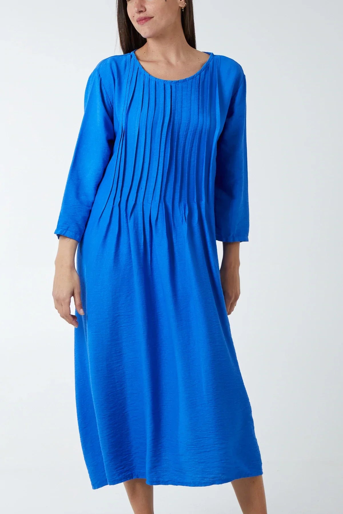 Blue pin-tuck bodice cotton dress with three-quarter sleeves, suitable for casual or special occasions.