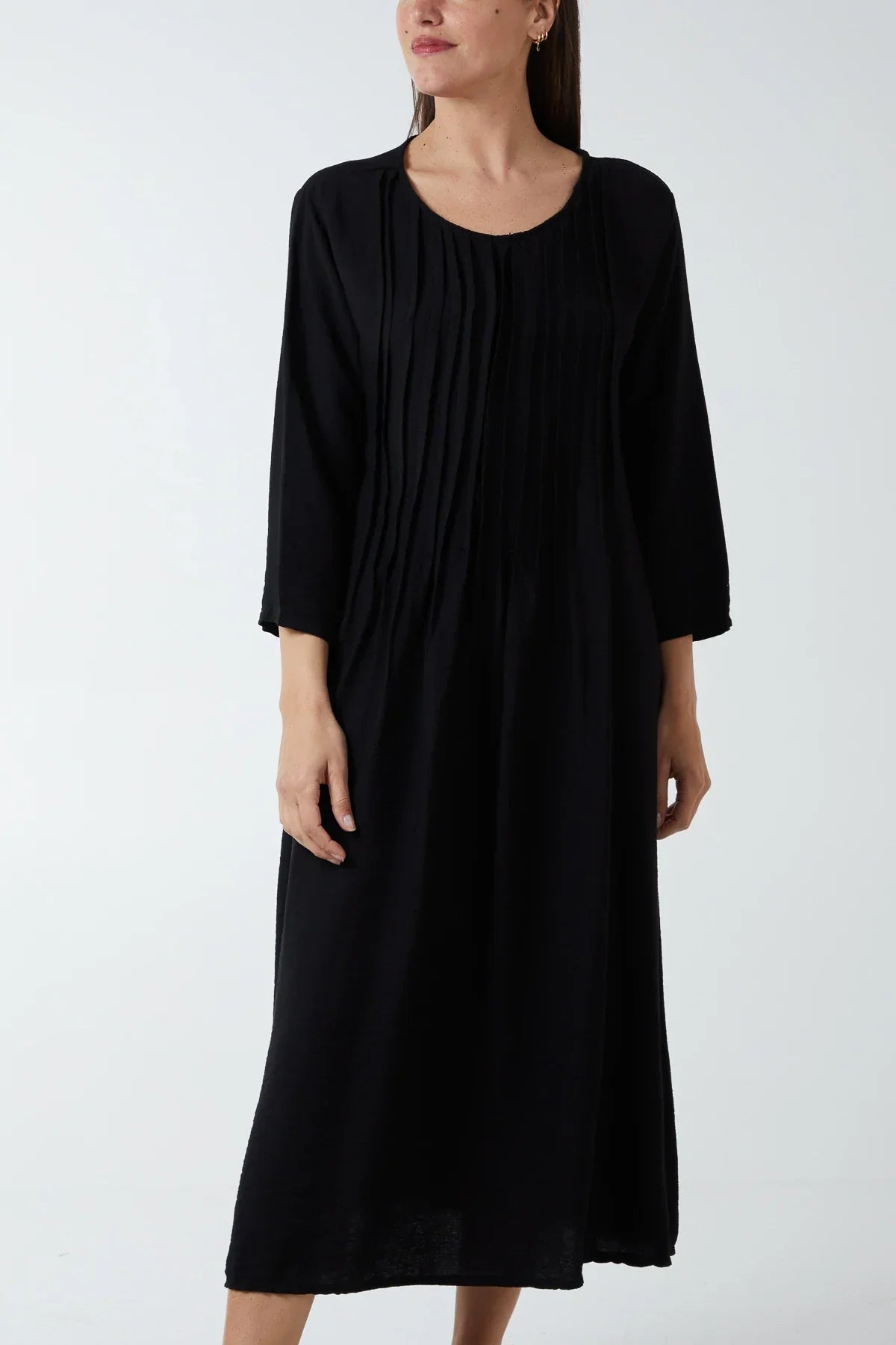 Pin-tuck Bodice Cotton Dress in black with three-quarter sleeves.