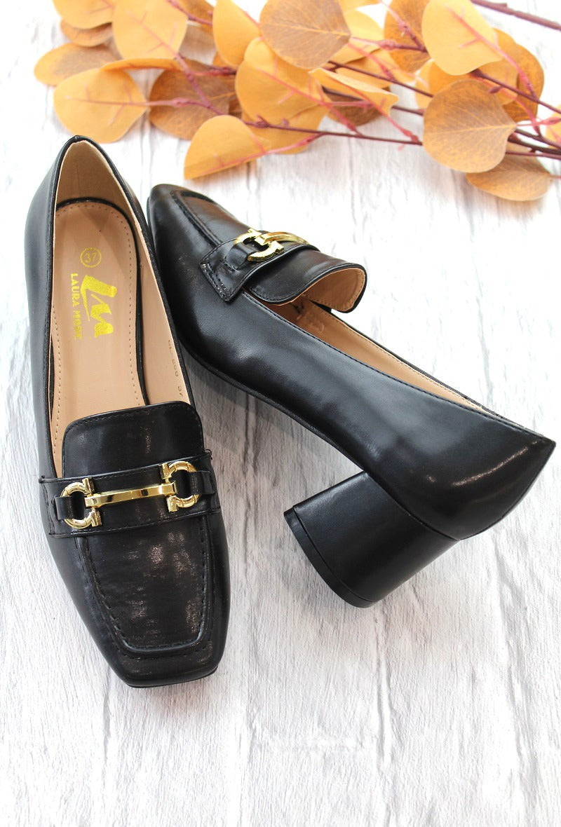 Gold Bar Office Shoe made of synthetic material with gold accents.
