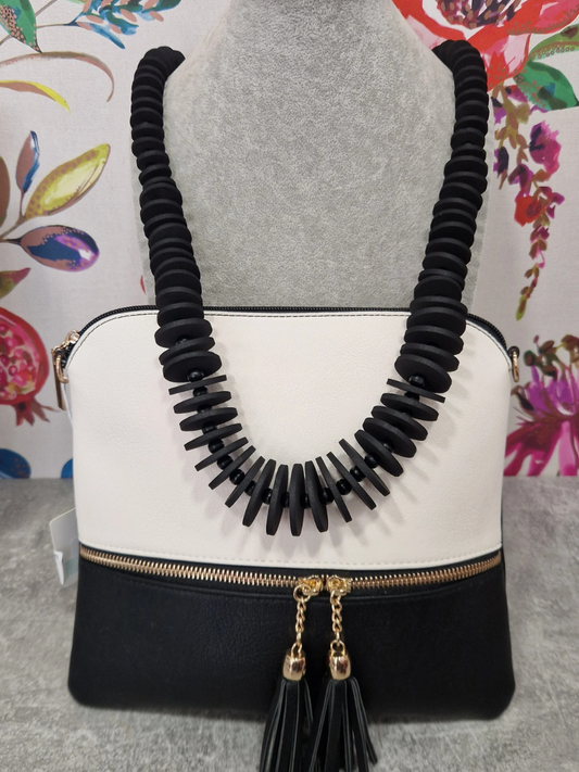 Monochrome bag and necklace gift bundle, perfect for special occasions.