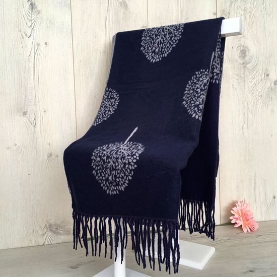 Cashmere Winter Scarf with a tree design and tassels on a display stand. Navy