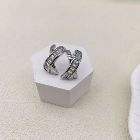 Half Loop Earrings, silver stud design on white display.