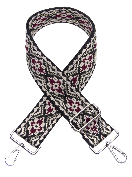 Embroidered wide bag strap with adjustable clips and intricate patterns.