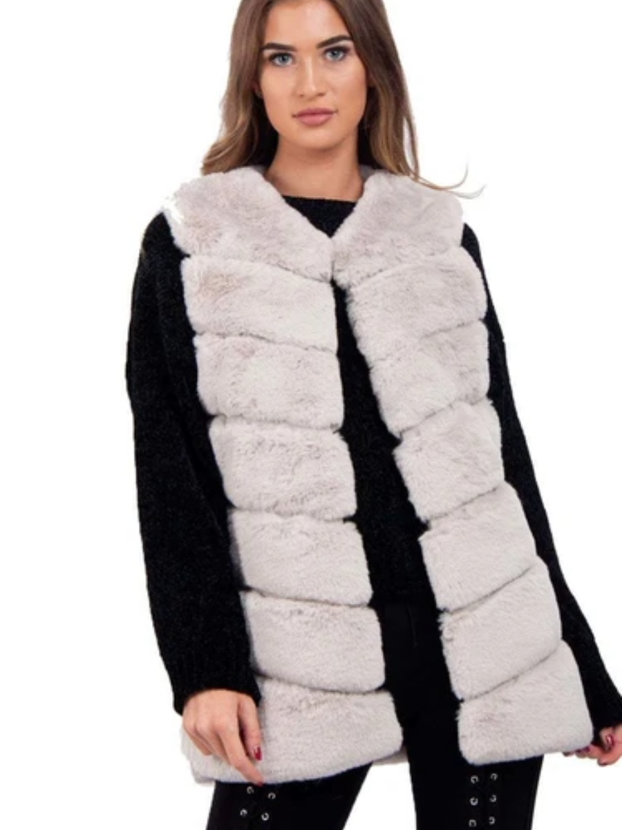Ladies faux fur gilet with silk and leather look lining, slightly longer fit.
