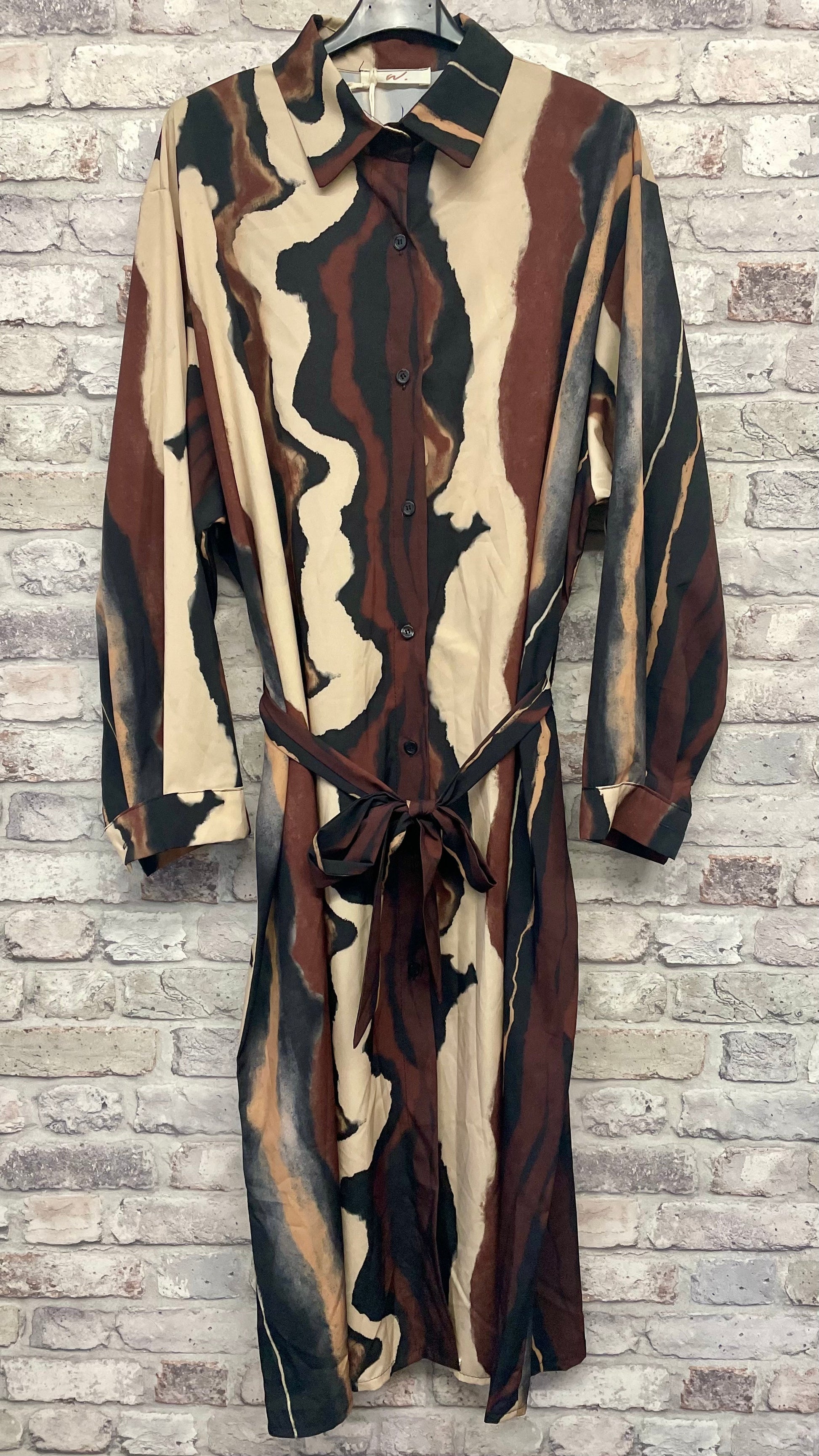 Wave Shirt Dress with abstract pattern, 96% polyester, 4% elastane, long-sleeved design, and belt detail.
