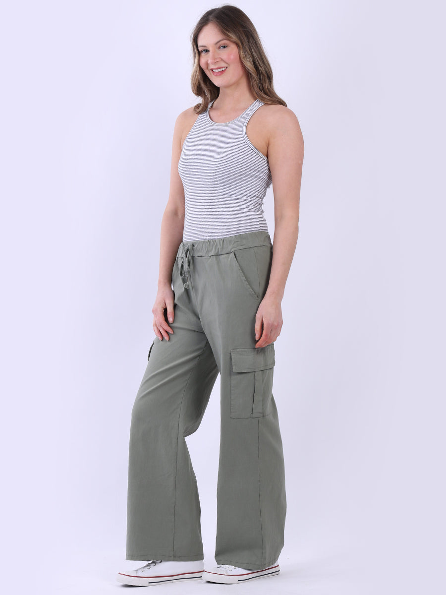 Women wearing wide-leg casual magic trousers with drawstring waist and knee flap pockets.