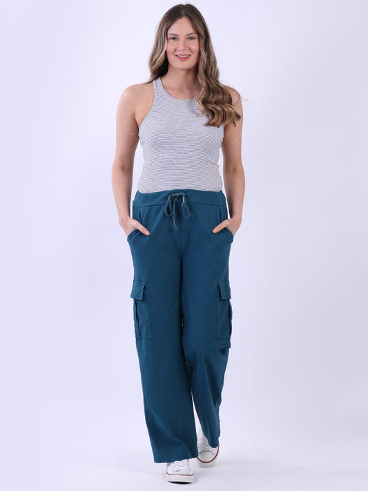 Women wearing wide leg casual magic trousers with drawstring waist and knee flap pockets.
