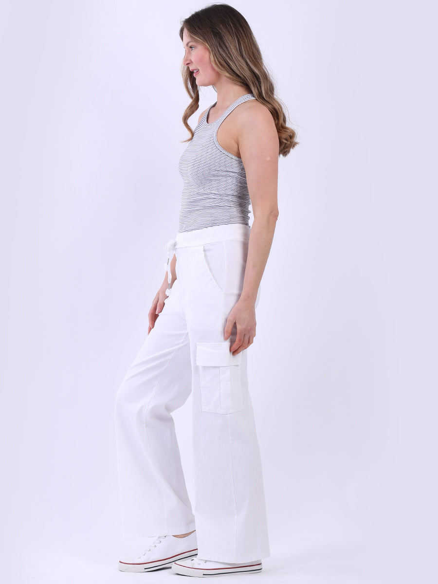 Women wearing white wide-leg casual magic trousers with knee flap pockets and drawstring waist.