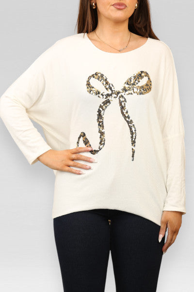 Sequin Bow Top - Long Sleeve Soft Touch Material shown on model.