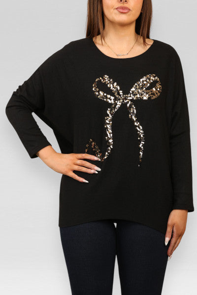 Sequin Bow Top - Long Sleeve Soft Touch Material shown on model.