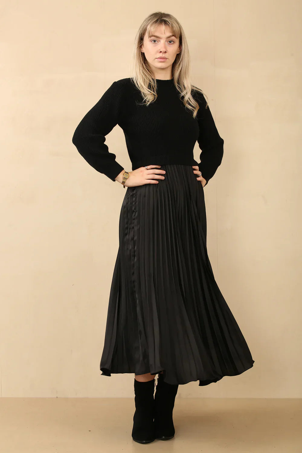 Knitted pleated jumper dress with satin look pleated skirt.